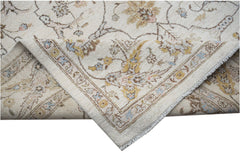 A handwoven Afghan Chobi rug featuring a traditional floral pattern in soft, earthy tones.