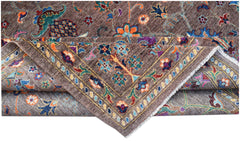 A handwoven Afghan Chobi rug featuring a brown field with colorful floral and vine patterns.