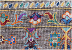 A close-up of a handwoven Afghan Chobi rug featuring intricate floral motifs in vibrant colors.