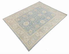 An Afghan Chobi rug featuring a traditional floral pattern in shades of blue and beige.