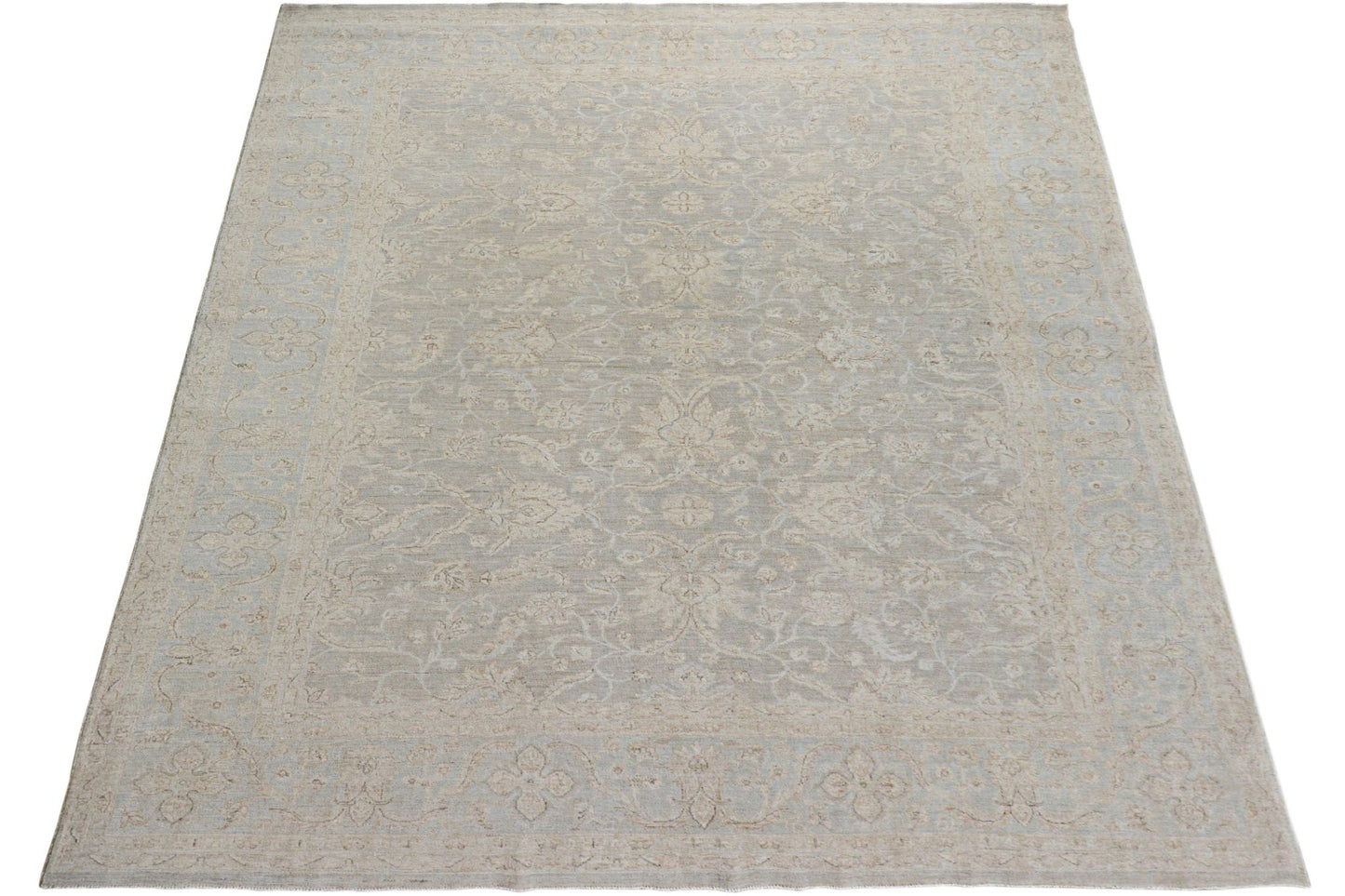 A handmade Afghan Chobi rug featuring a traditional floral pattern in soft beige and grey tones.