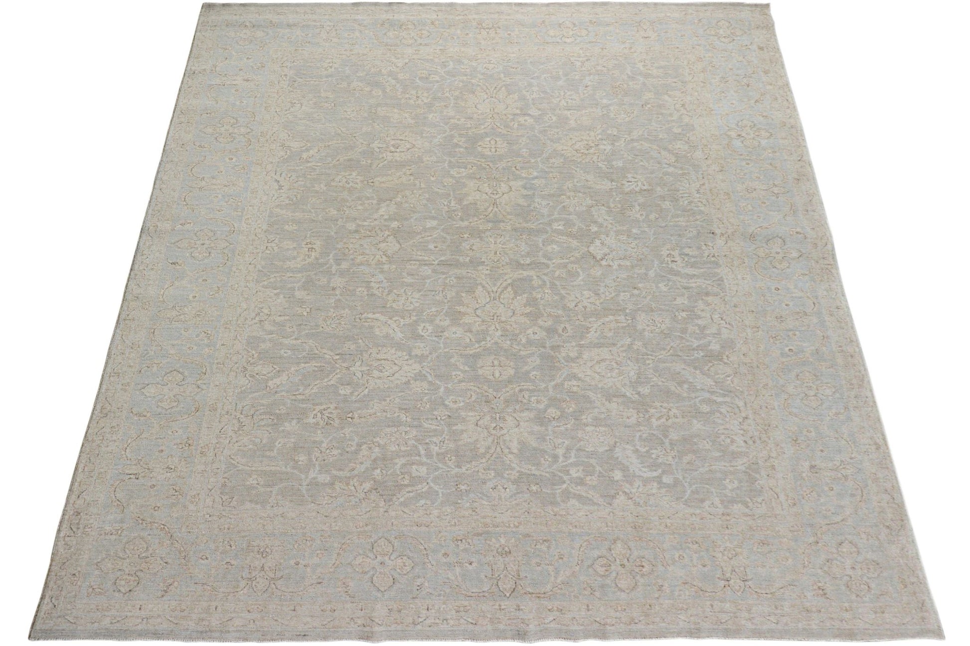 A handmade Afghan Chobi rug featuring a traditional floral pattern in soft beige and grey tones.