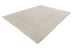 A handmade Afghan Chobi rug featuring a subtle, light-toned floral pattern on a wool pile.