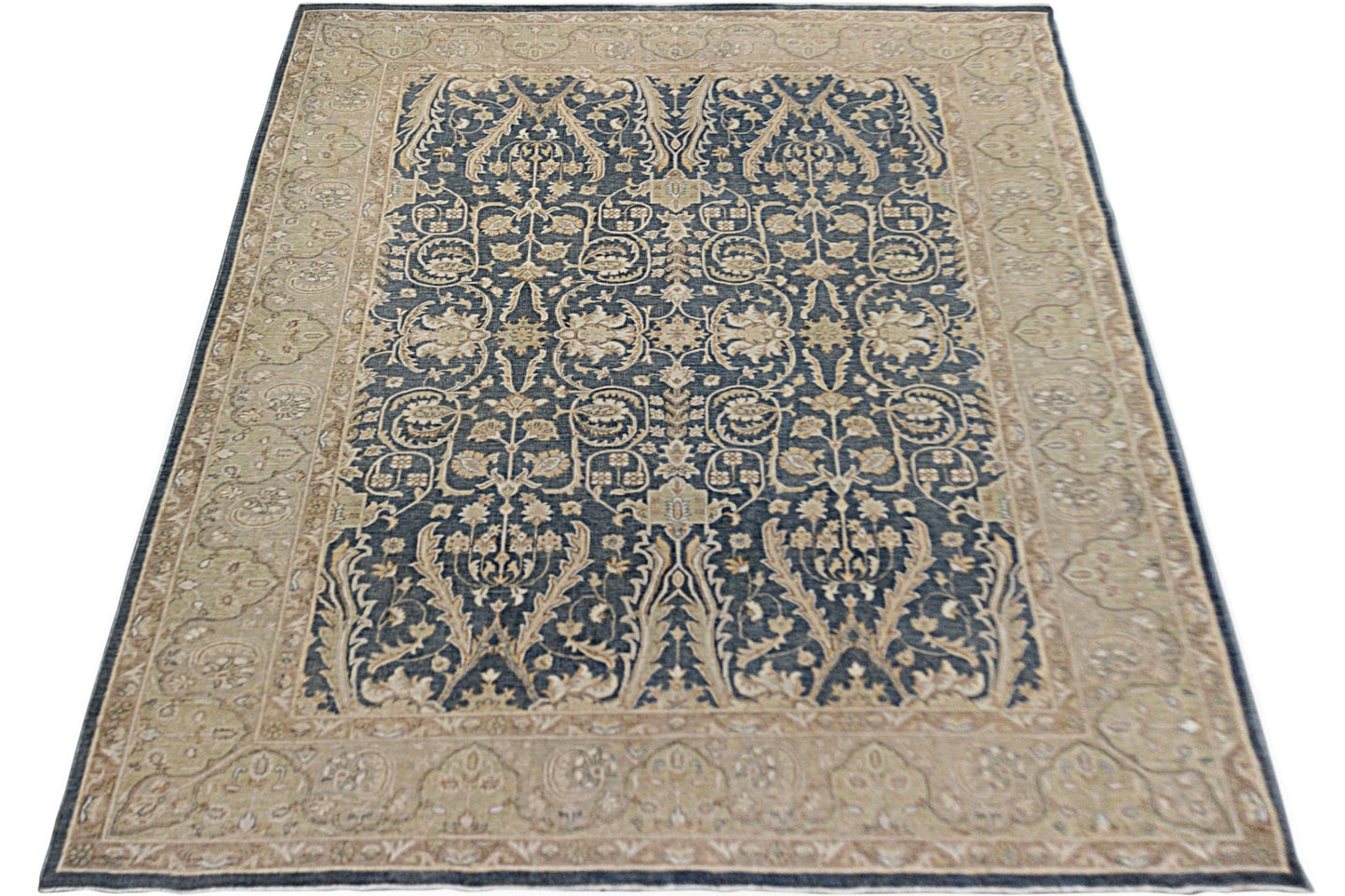 A rectangular Afghan Chobi rug featuring a dark blue field with intricate beige floral patterns.