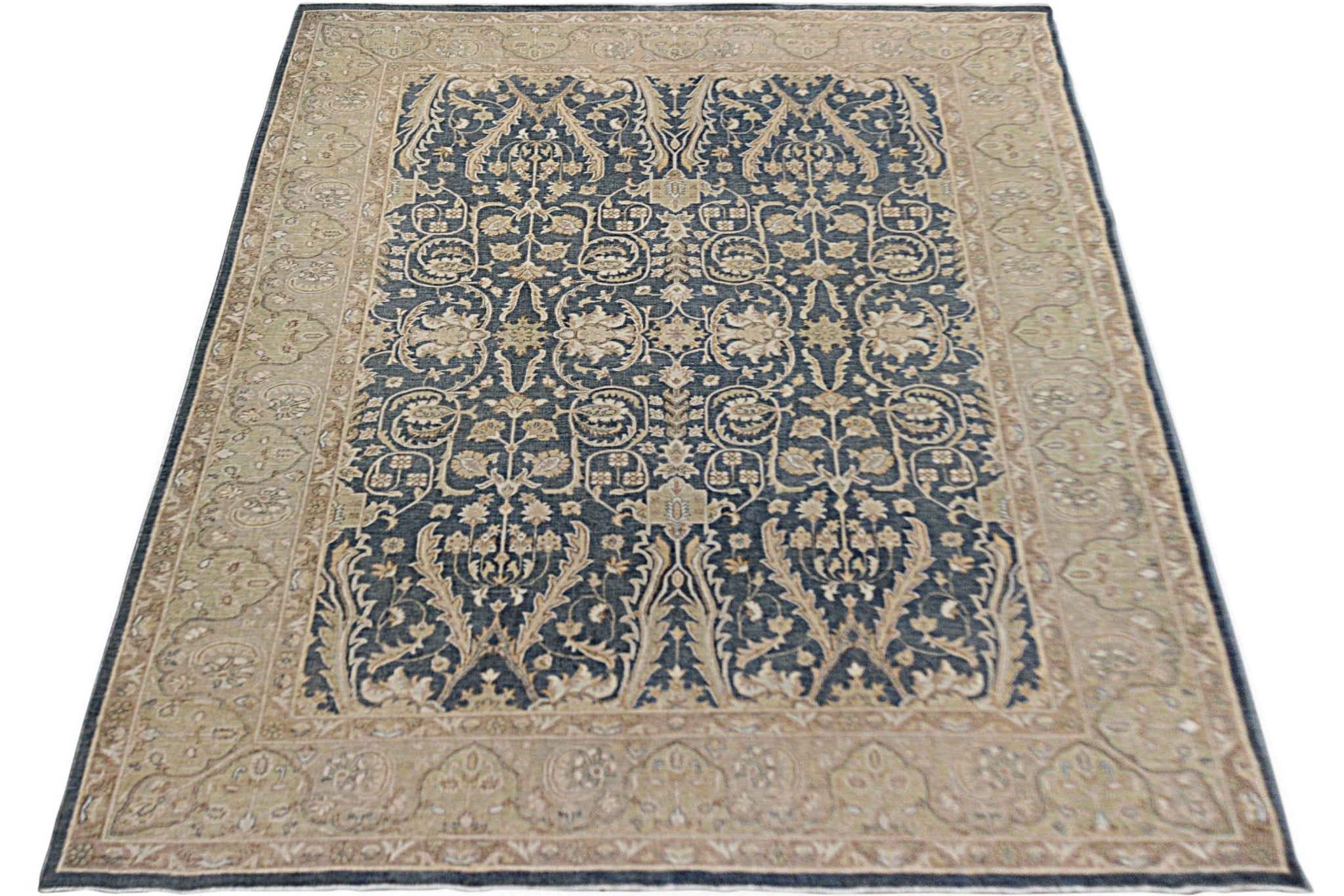 A rectangular Afghan Chobi rug featuring a dark blue field with intricate beige floral patterns.