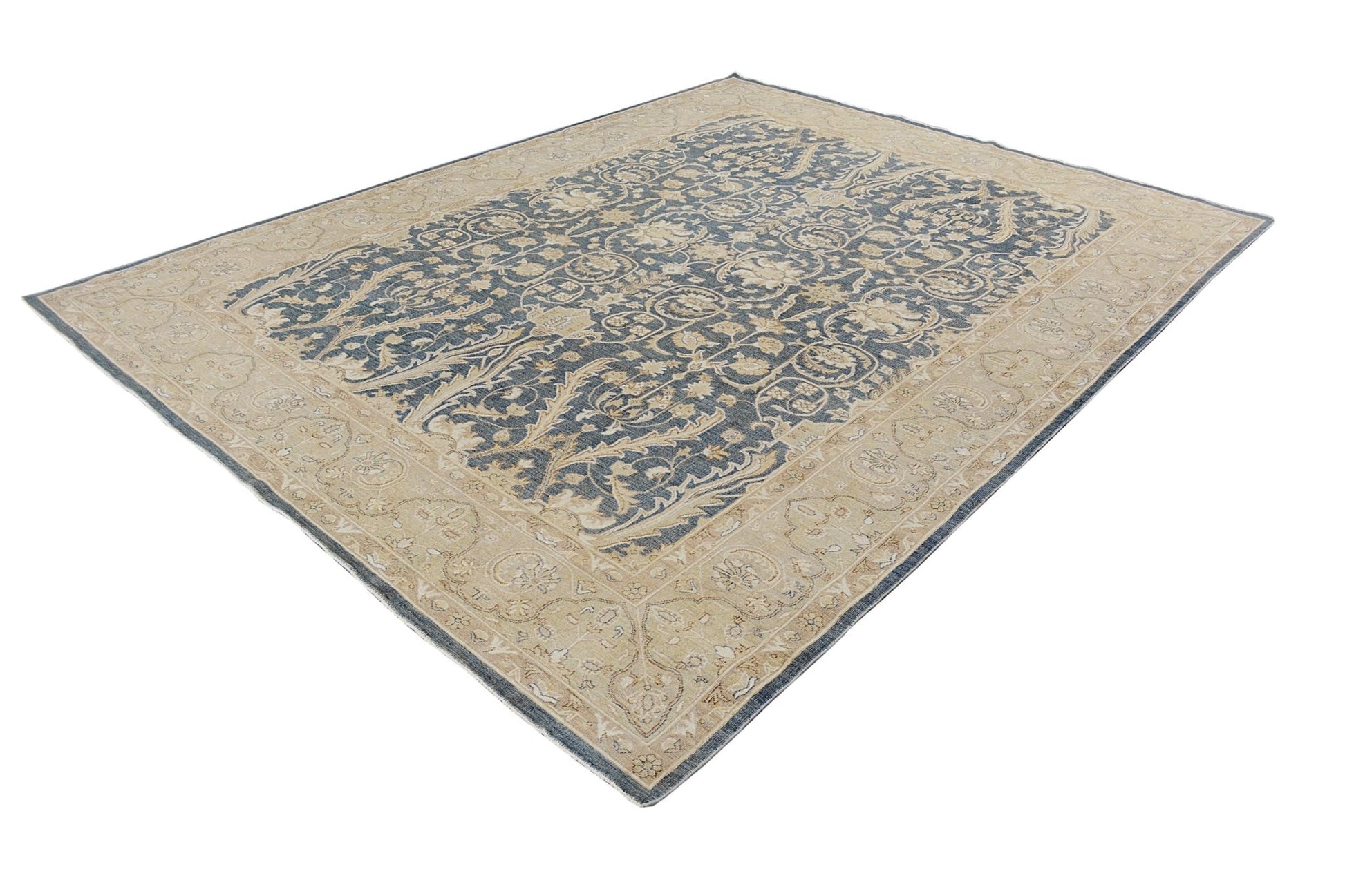 A handmade Afghan Chobi rug featuring a traditional floral pattern in blue and beige tones.
