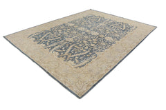 A handmade Afghan Chobi rug featuring a traditional floral pattern in blue and beige tones.