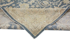 A handmade Afghan Chobi rug featuring a traditional floral pattern in shades of blue and beige.
