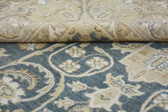 A handmade Afghan Chobi rug featuring a traditional floral pattern in blue and beige tones.