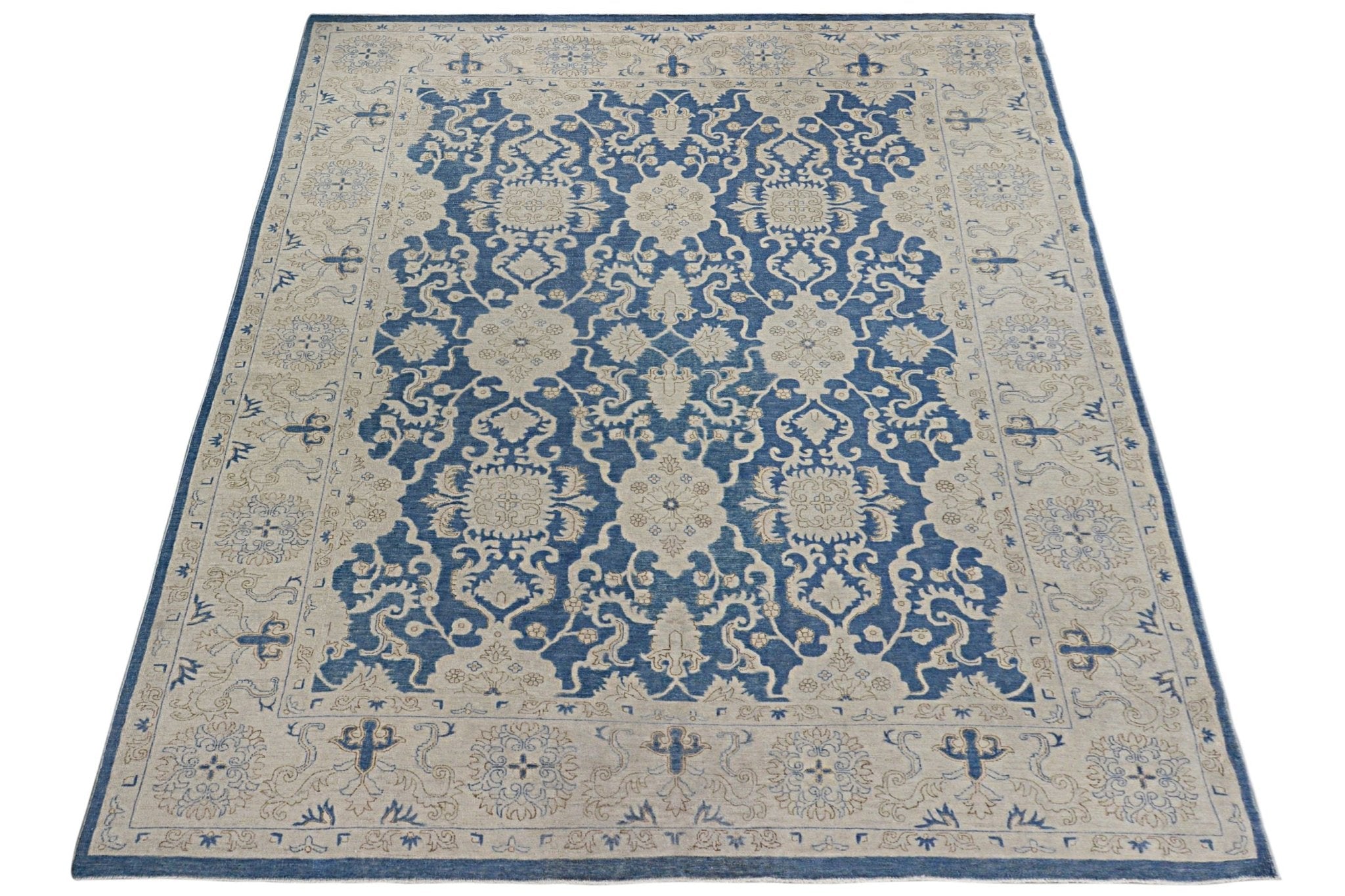 A rectangular Afghan Chobi rug featuring a traditional blue and beige floral pattern.