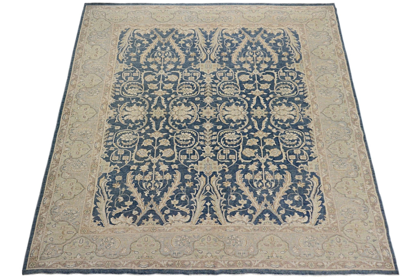 A rectangular Afghan Chobi rug featuring a traditional floral pattern in blue and beige tones.