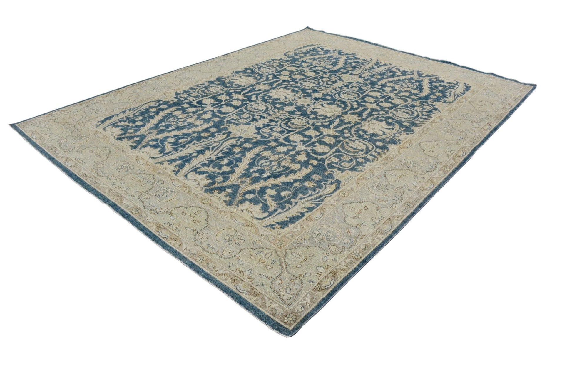 An Afghan Chobi rug featuring a traditional blue and beige floral pattern on handspun wool.