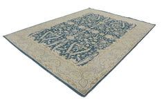 An Afghan Chobi rug featuring a traditional blue and beige floral pattern on handspun wool.