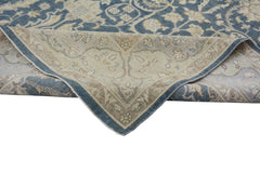 A handmade Afghan Chobi rug featuring a traditional floral pattern in blue and beige tones.