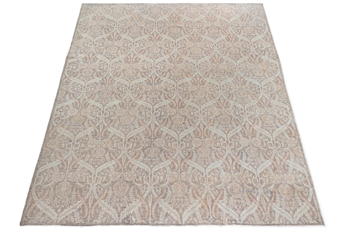 An Afghan Chobi rug featuring a traditional intricate floral pattern in soft beige and brown tones.