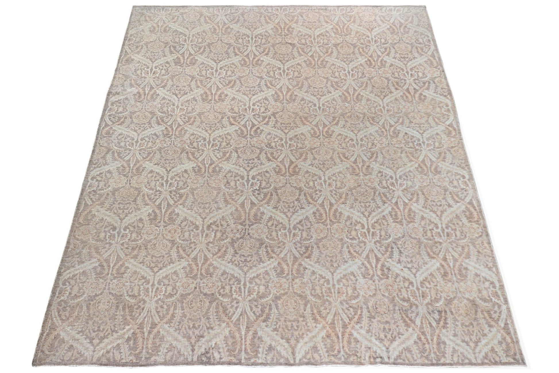 An Afghan Chobi rug featuring a traditional intricate floral pattern in soft beige and brown tones.