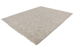 A handmade Afghan Chobi rug featuring a traditional floral pattern in neutral wood tones.