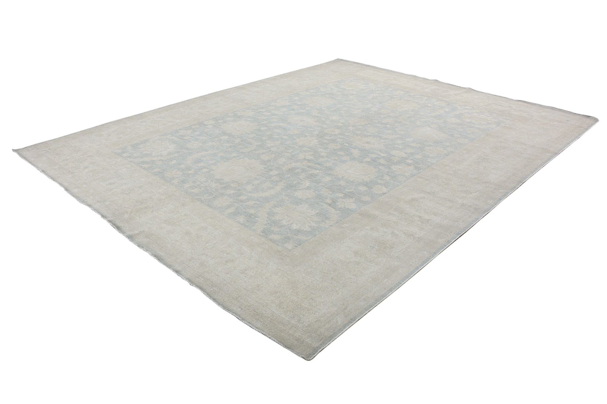 An Afghan Chobi rug featuring a traditional floral pattern in soft blue and beige tones.
