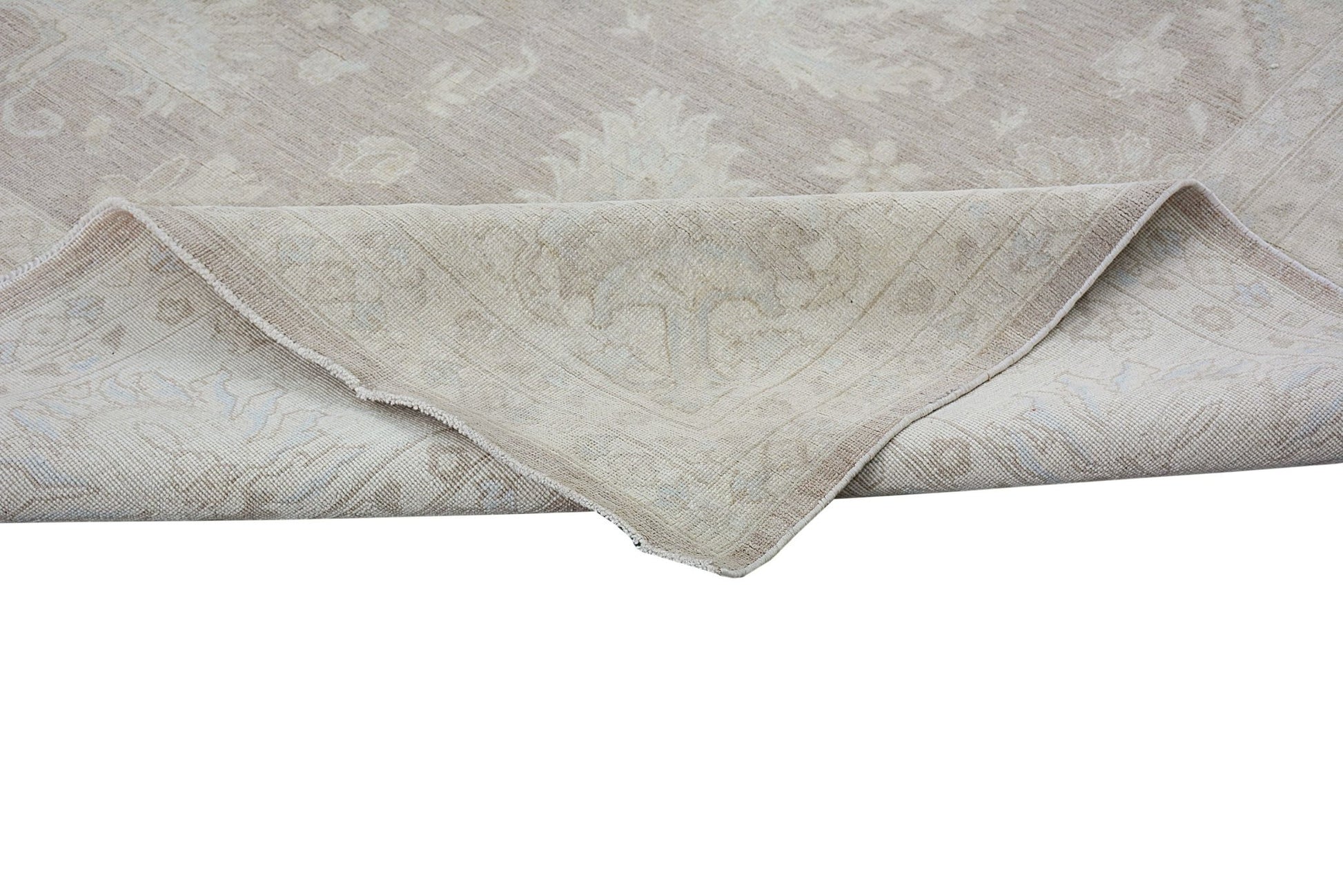 A handmade Afghan Chobi rug in neutral beige tones with a traditional floral pattern.