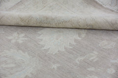 A handmade Afghan Chobi rug featuring a neutral, monochromatic floral pattern on handspun wool.