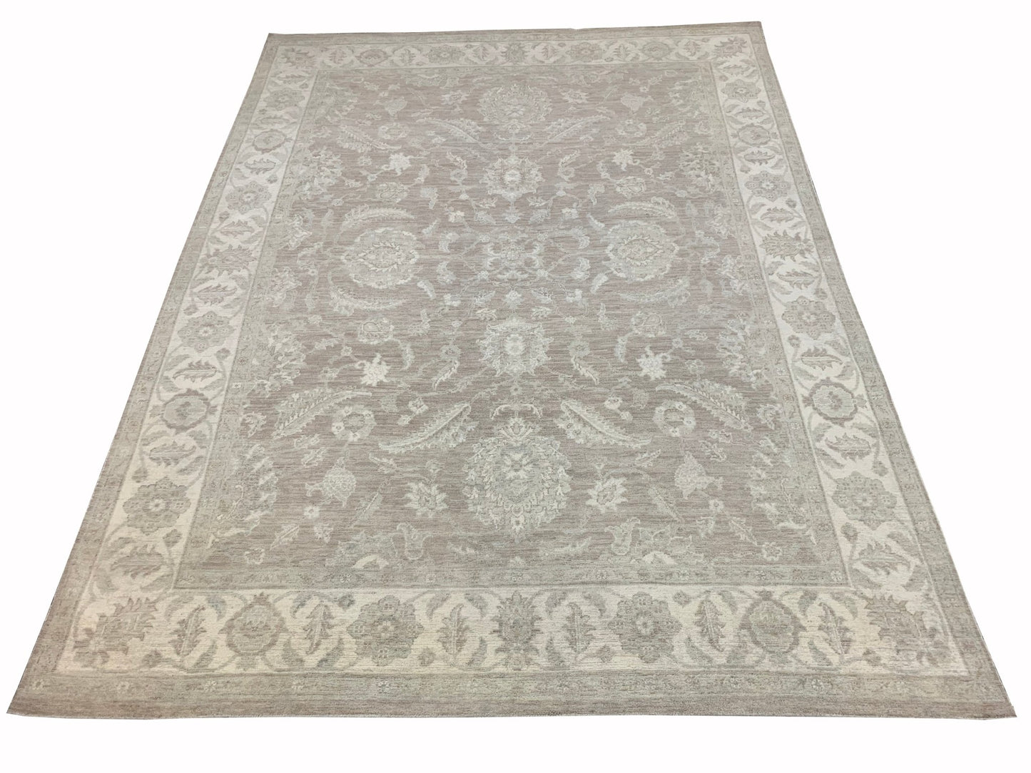 A handmade Afghan Chobi rug featuring a traditional floral pattern in neutral beige tones.