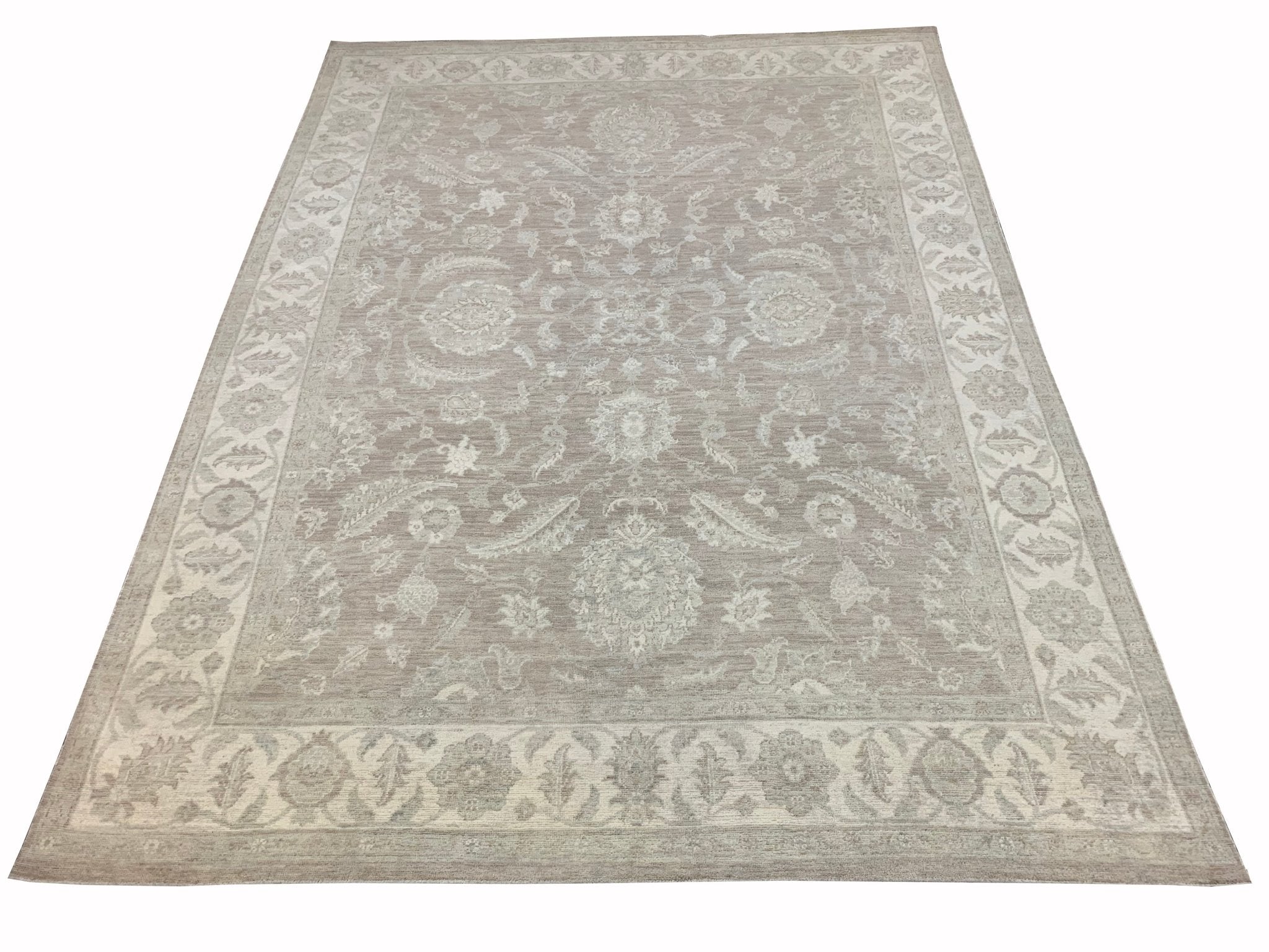 A handmade Afghan Chobi rug featuring a traditional floral pattern in neutral beige tones.