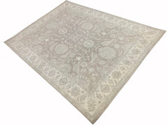 A rectangular Afghan Chobi rug featuring a traditional floral pattern in neutral beige tones.