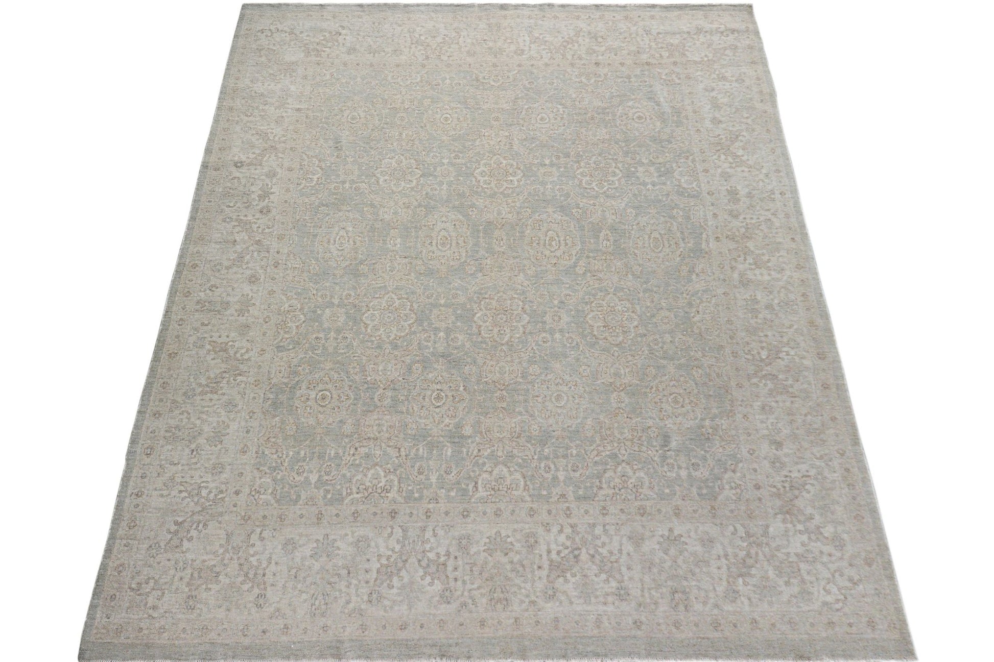A handmade Afghan Chobi rug featuring a traditional floral pattern in soft beige and grey tones.