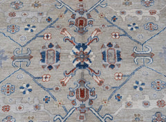 Handwoven Afghan Chobi rug featuring a traditional floral pattern in blue, red, and beige tones.