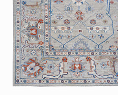 A handwoven Afghan Chobi rug featuring a traditional floral pattern in blue, red, and beige tones.
