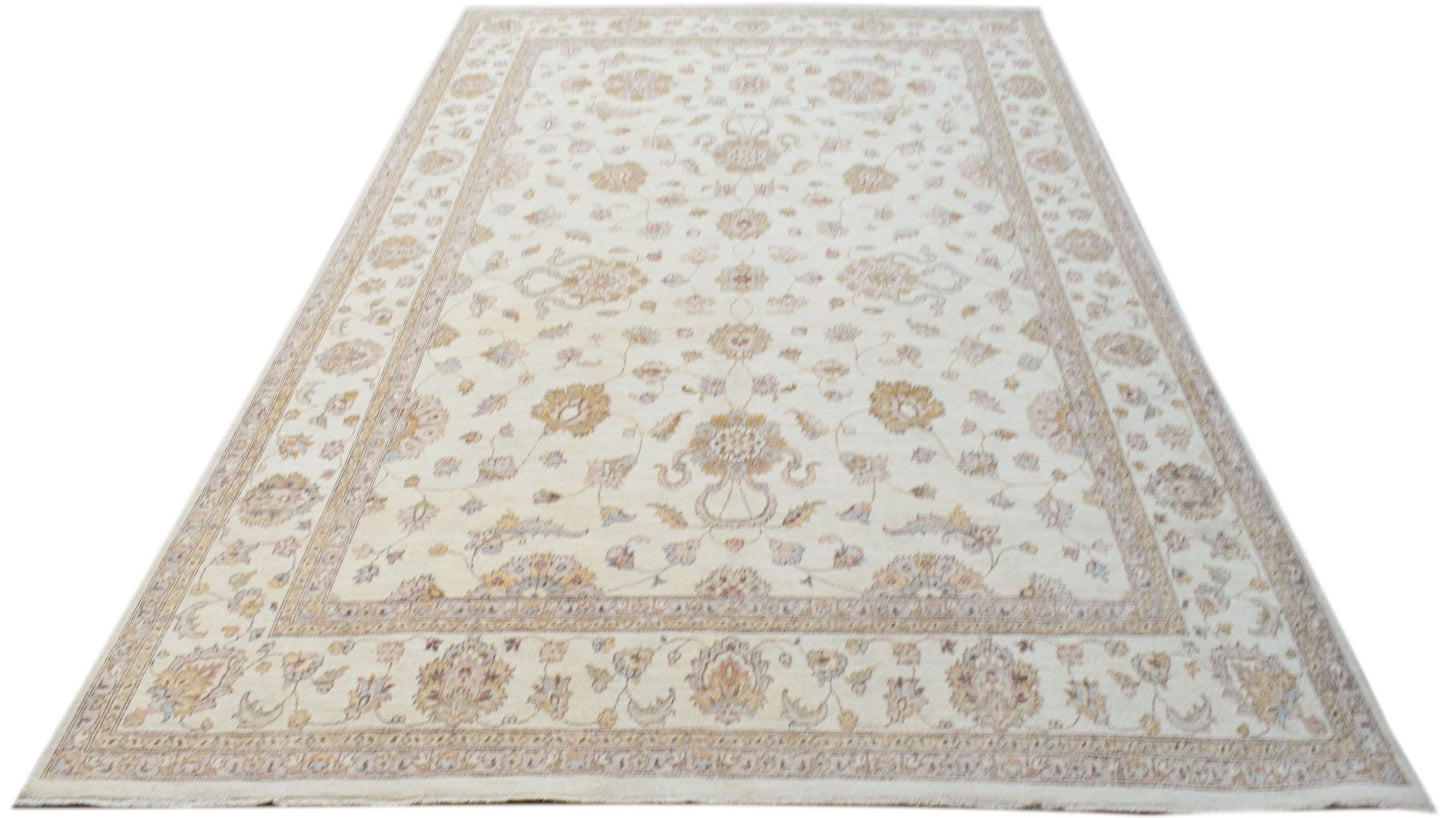 An Afghan Chobi rug featuring a traditional floral pattern in soft, neutral wood tones.