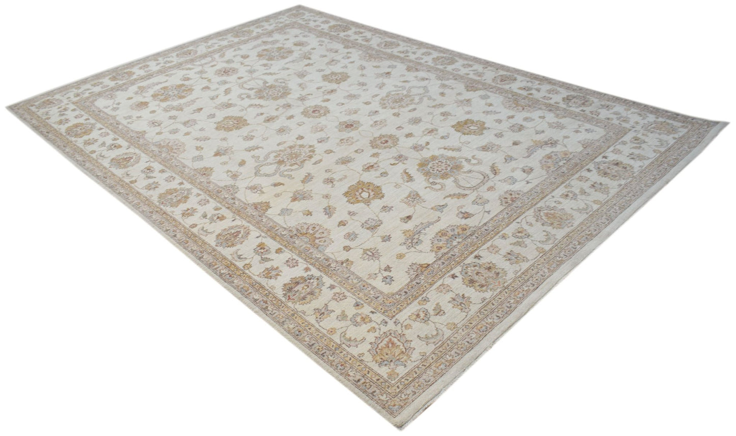 An Afghan Chobi rug featuring a traditional floral pattern in soft beige and wood-toned hues.
