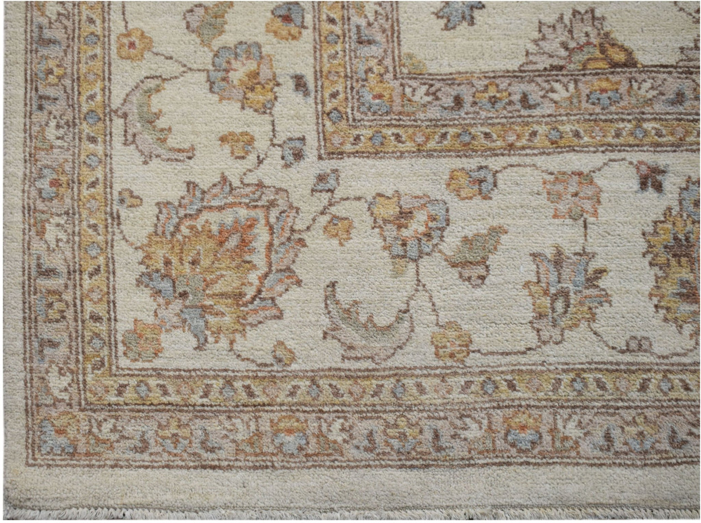 A handmade Afghan Chobi rug featuring a traditional floral pattern in soft, earthy tones.