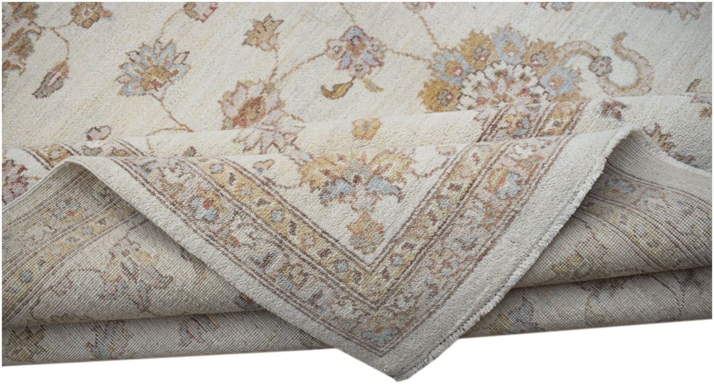 An Afghan Chobi rug with a cream background and traditional floral patterns in muted earth tones.