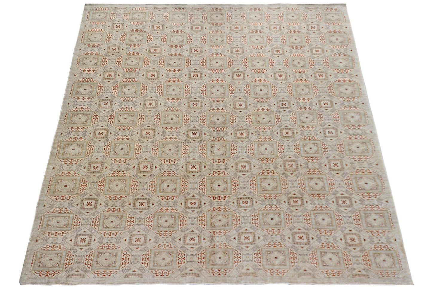 An Afghan Chobi rug featuring a repeating geometric pattern in earthy tones on a light background.