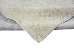A handmade Afghan Chobi rug in neutral beige tones with a traditional patterned design.