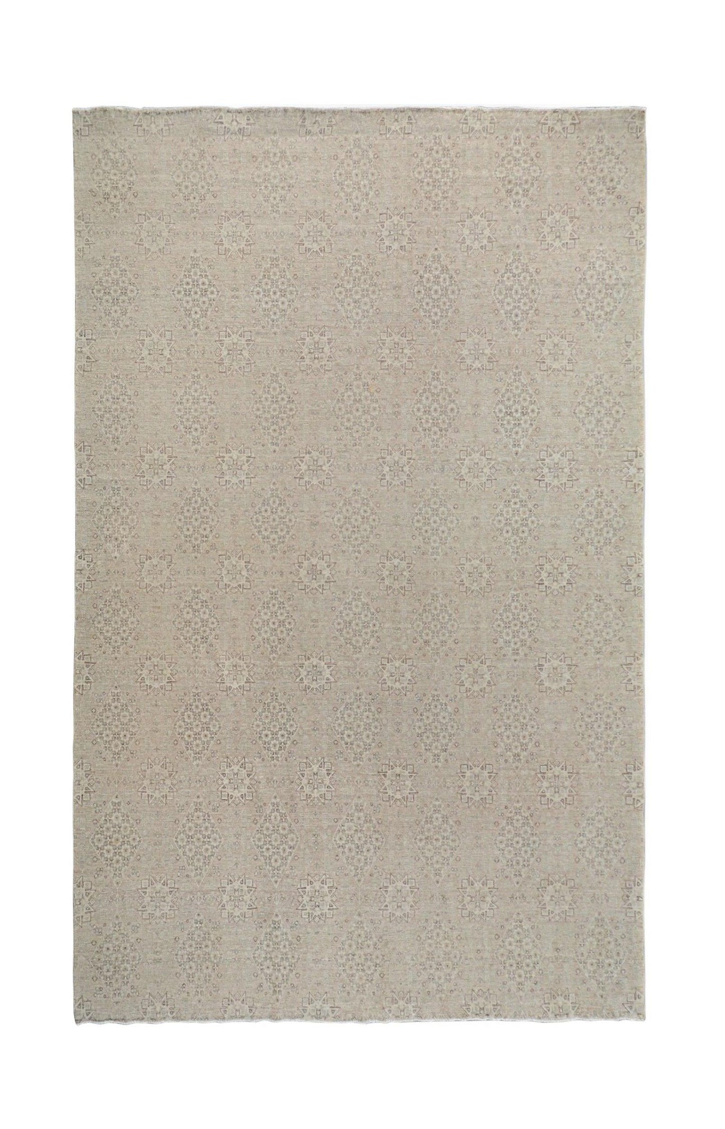 An Afghan Chobi rug featuring a traditional geometric pattern in soft, neutral wood tones.