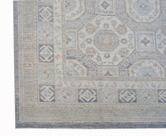 A handmade Afghan Chobi rug featuring a traditional geometric pattern in soft, muted earth tones.