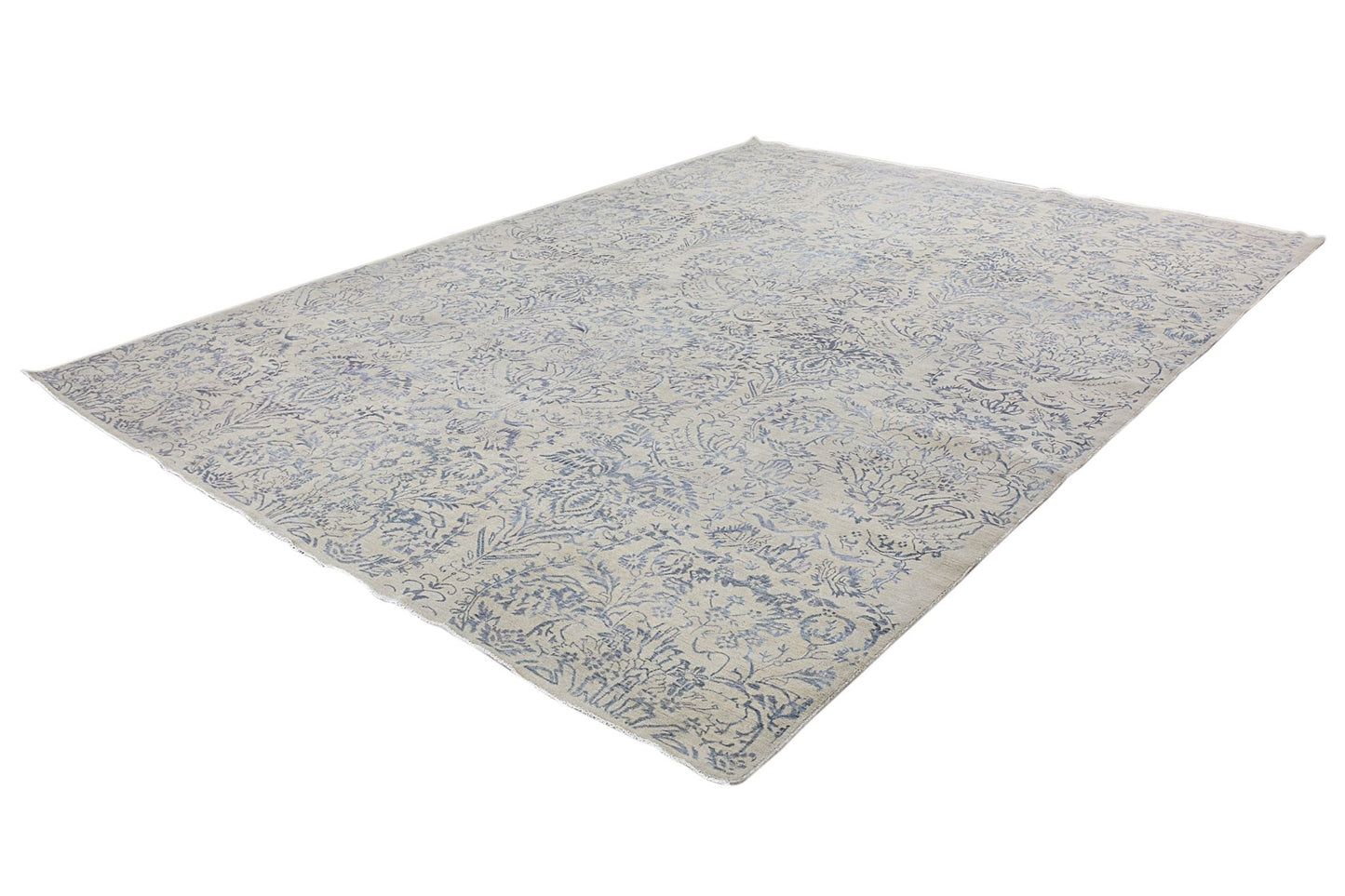An Afghan Chobi rug featuring a traditional blue floral pattern on a light beige wool background.
