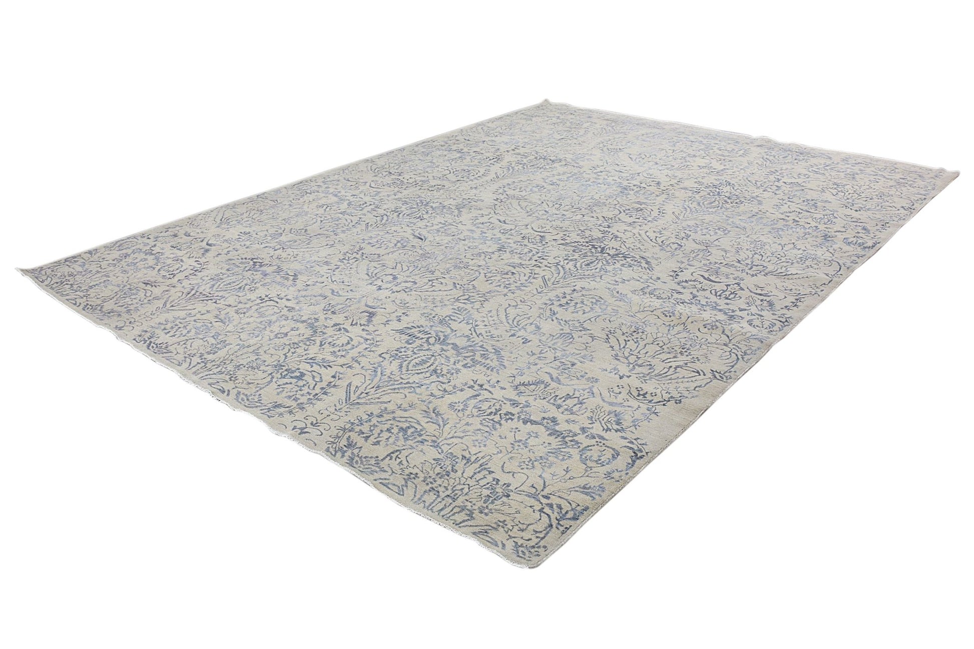 An Afghan Chobi rug featuring a traditional blue floral pattern on a light beige wool background.