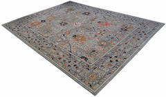 A rectangular Afghan Chobi rug featuring a traditional floral pattern in muted earth tones.