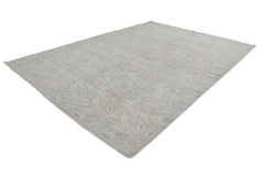 A handmade Afghan Chobi rug featuring a traditional floral vine pattern in soft neutral tones.