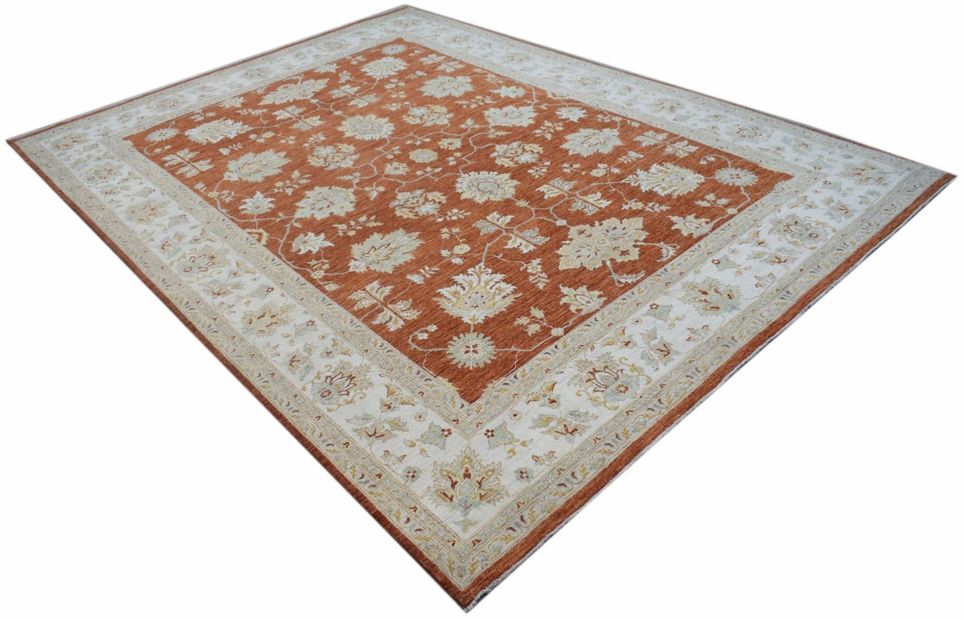An Afghan Chobi rug featuring a rust-orange field with intricate floral patterns and a cream border.