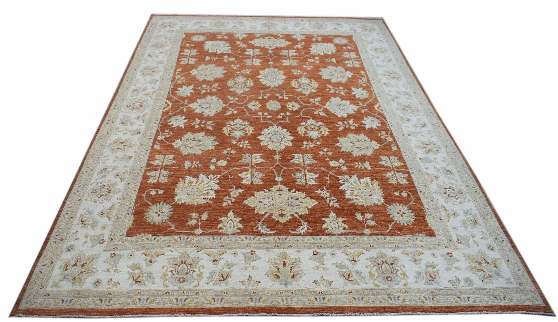 An Afghan Chobi rug featuring a rust-colored field with intricate floral patterns and a cream border.