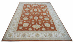 An Afghan Chobi rug featuring a rust-colored field with intricate floral patterns and a cream border.