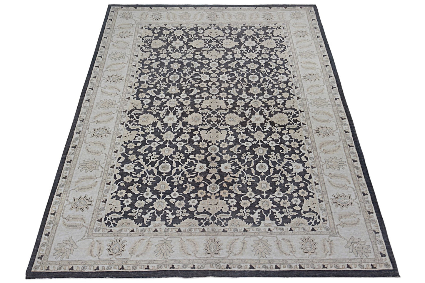 A rectangular Afghan Chobi rug featuring a dark field with intricate floral patterns and light borders.