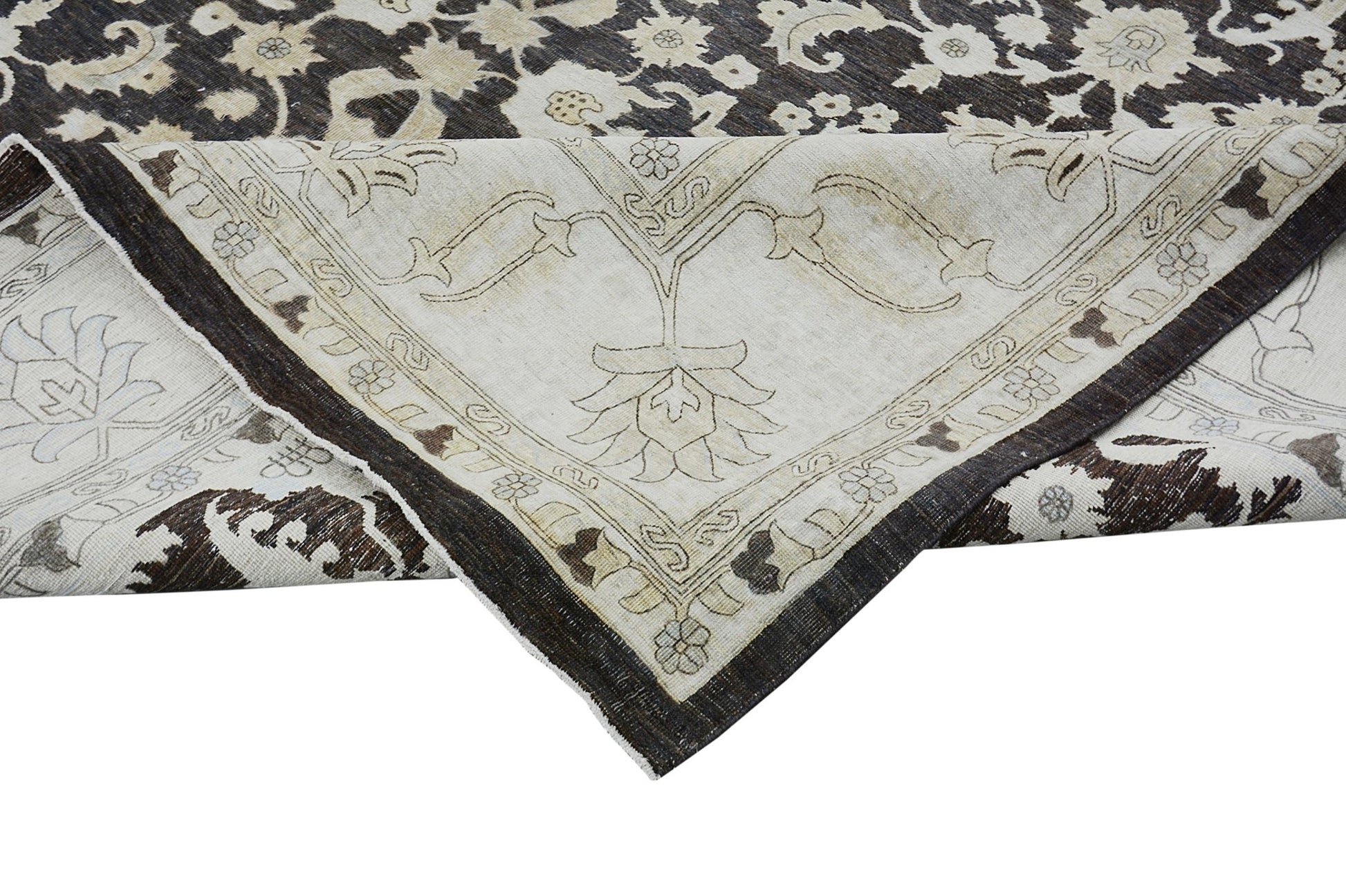 A handmade Afghan Chobi rug featuring a traditional floral pattern in dark brown and cream tones.