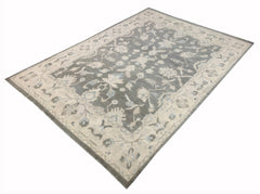 A handmade Afghan Chobi rug featuring a traditional floral pattern in grey and cream tones.