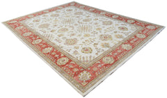 An Afghan Chobi rug featuring a cream field with floral patterns and a wide red border.