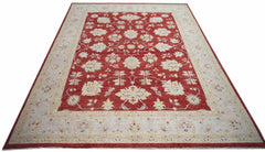 A rectangular Afghan Chobi rug featuring a traditional floral pattern in red and cream tones.